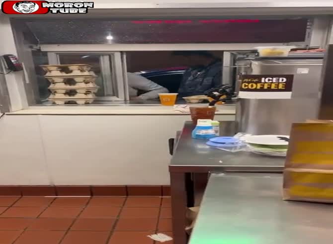 Video :Disgruntled patrons cause chaos at a McDonald's drive-thru and spit on a staff member